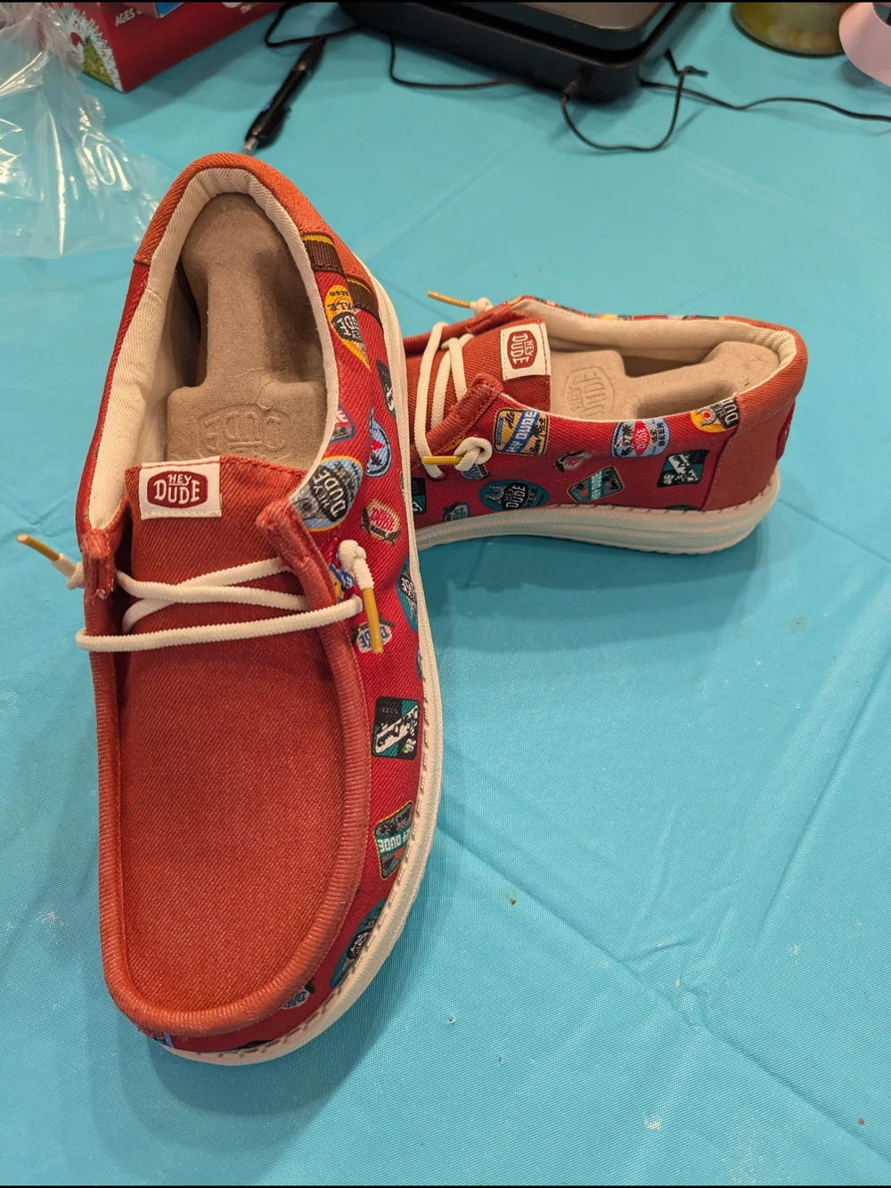 Never worn Hey Dude Men's 9 (Women's 11) Shoes with Badge Print